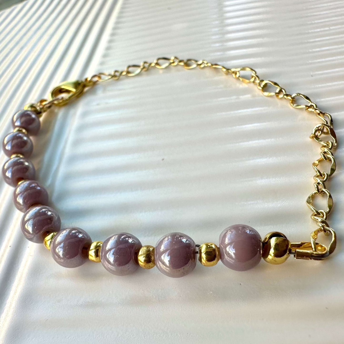 Beaded bracelet Violet Glow on table 2