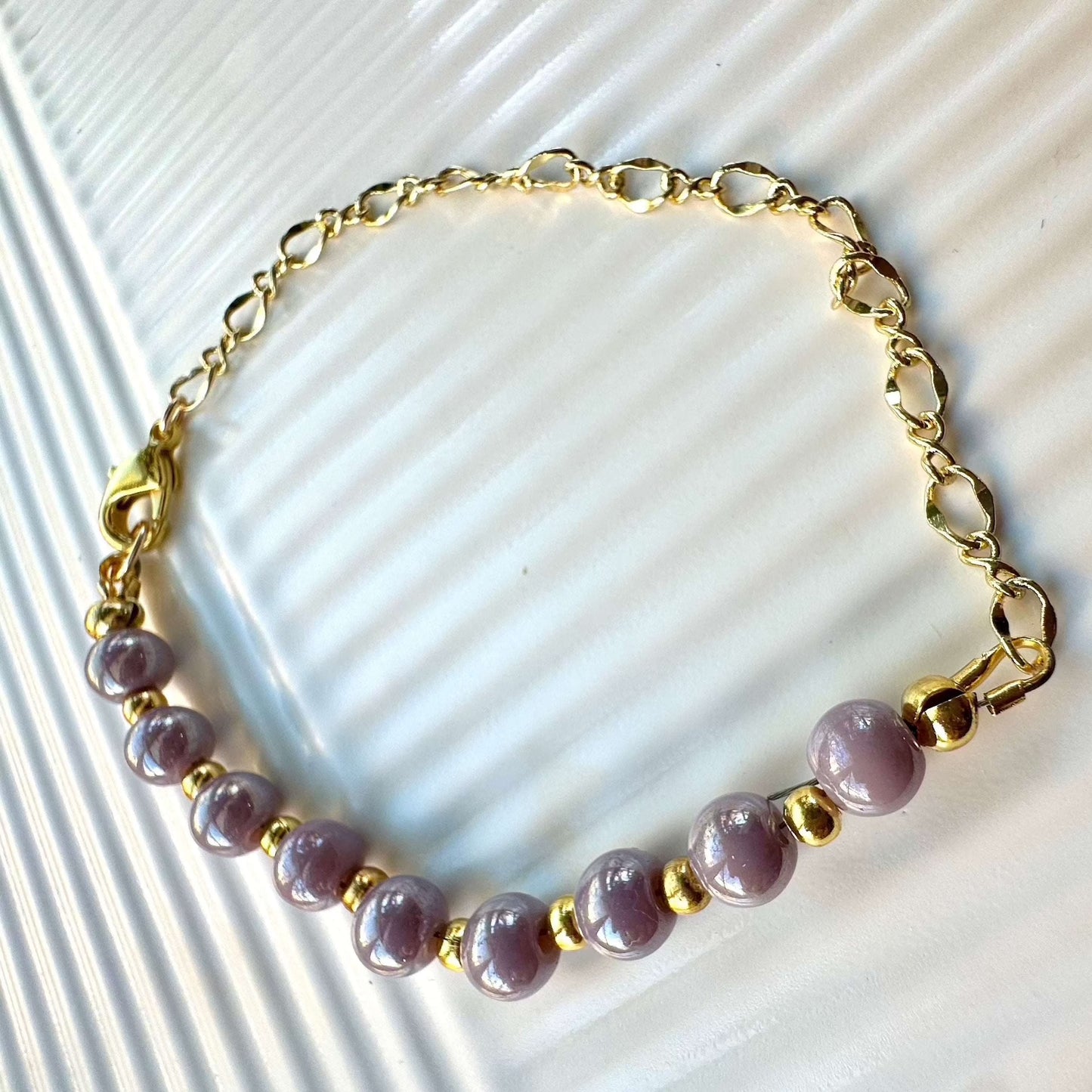 Beaded bracelet Violet Glow on table