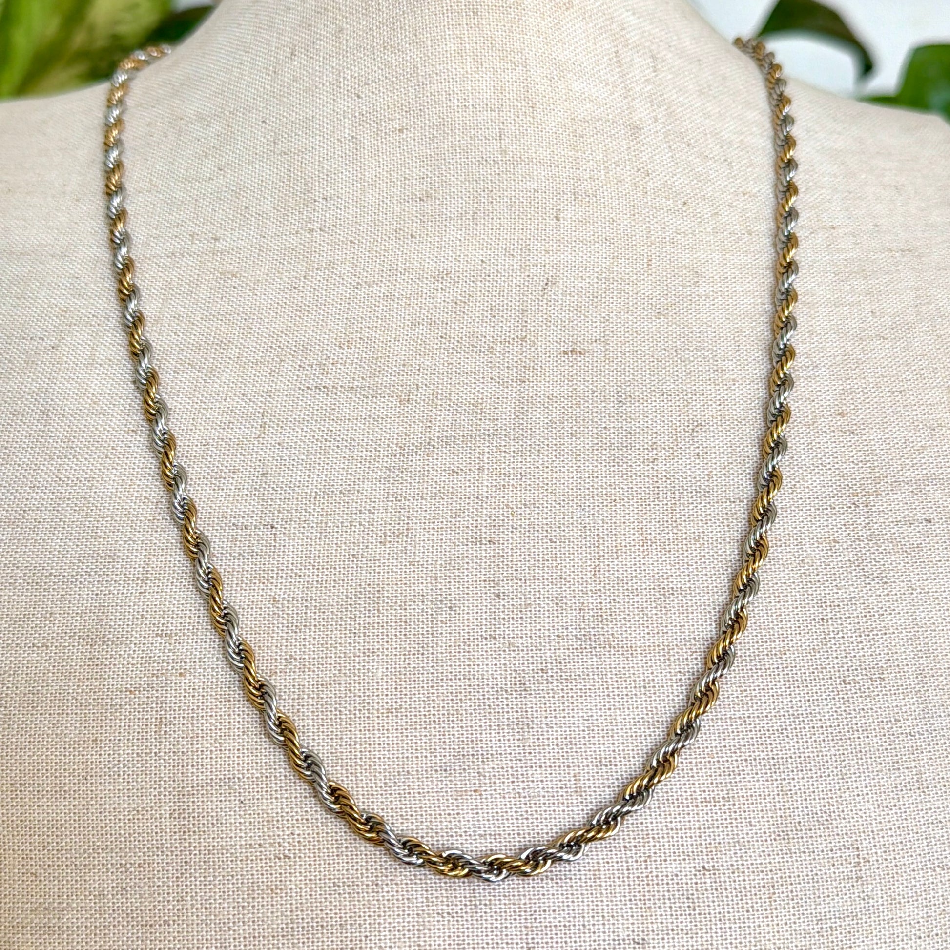 Necklace on a mannequin with a neutral background