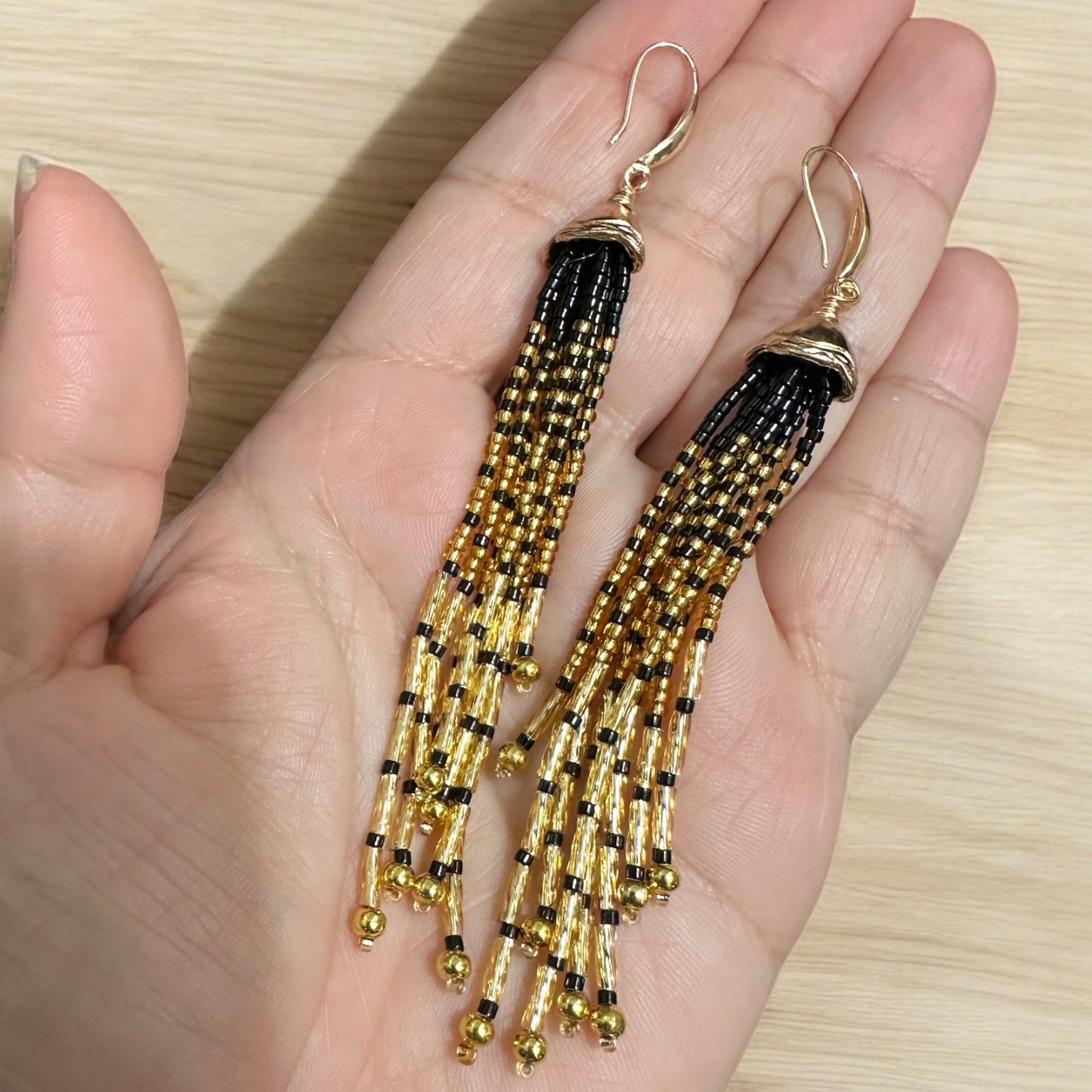 Golden Cascade earrings with gold filled ear wire held in hand