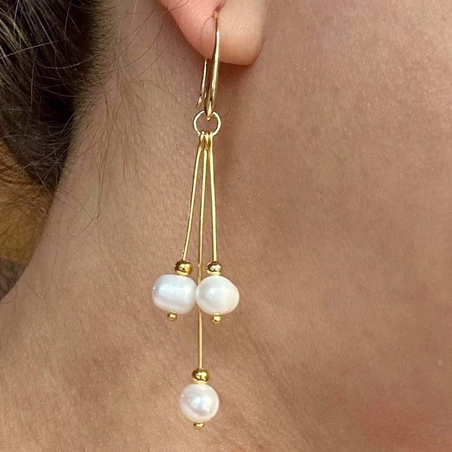 Pure Elegance Earrings - Gold Filled with pearls worn on ear