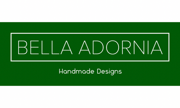 Bella Adornia logo with green background and white lettering