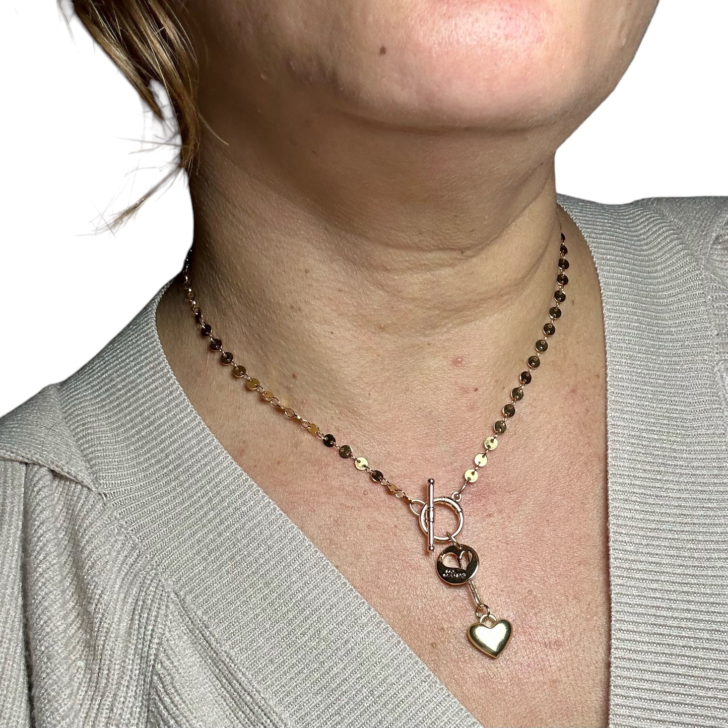 Gold-filled necklace with disc chain and  front closure toggle clasp with two heart pendants worn on neck